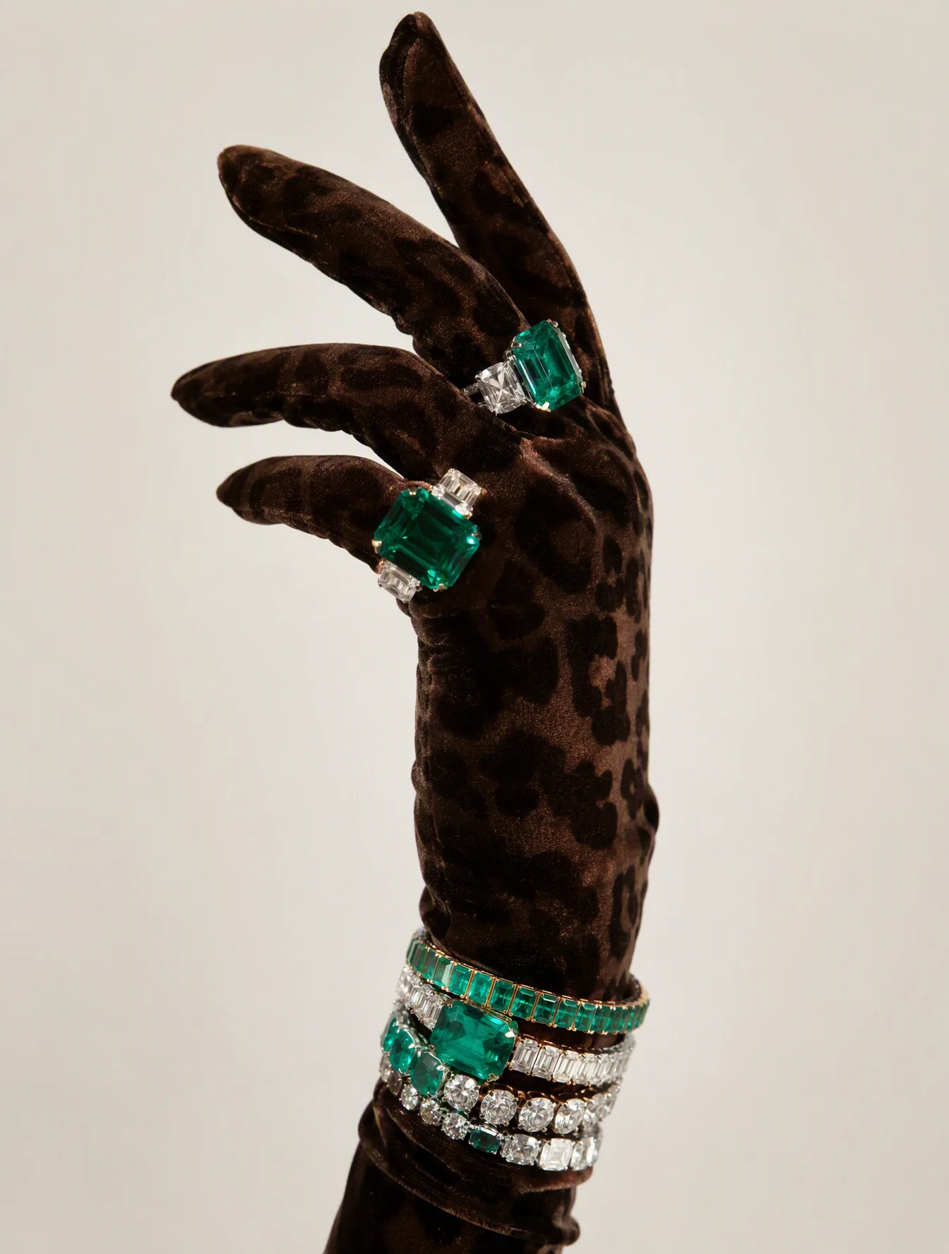 Luxury studio photograph of a feminine hand wearing a dee...